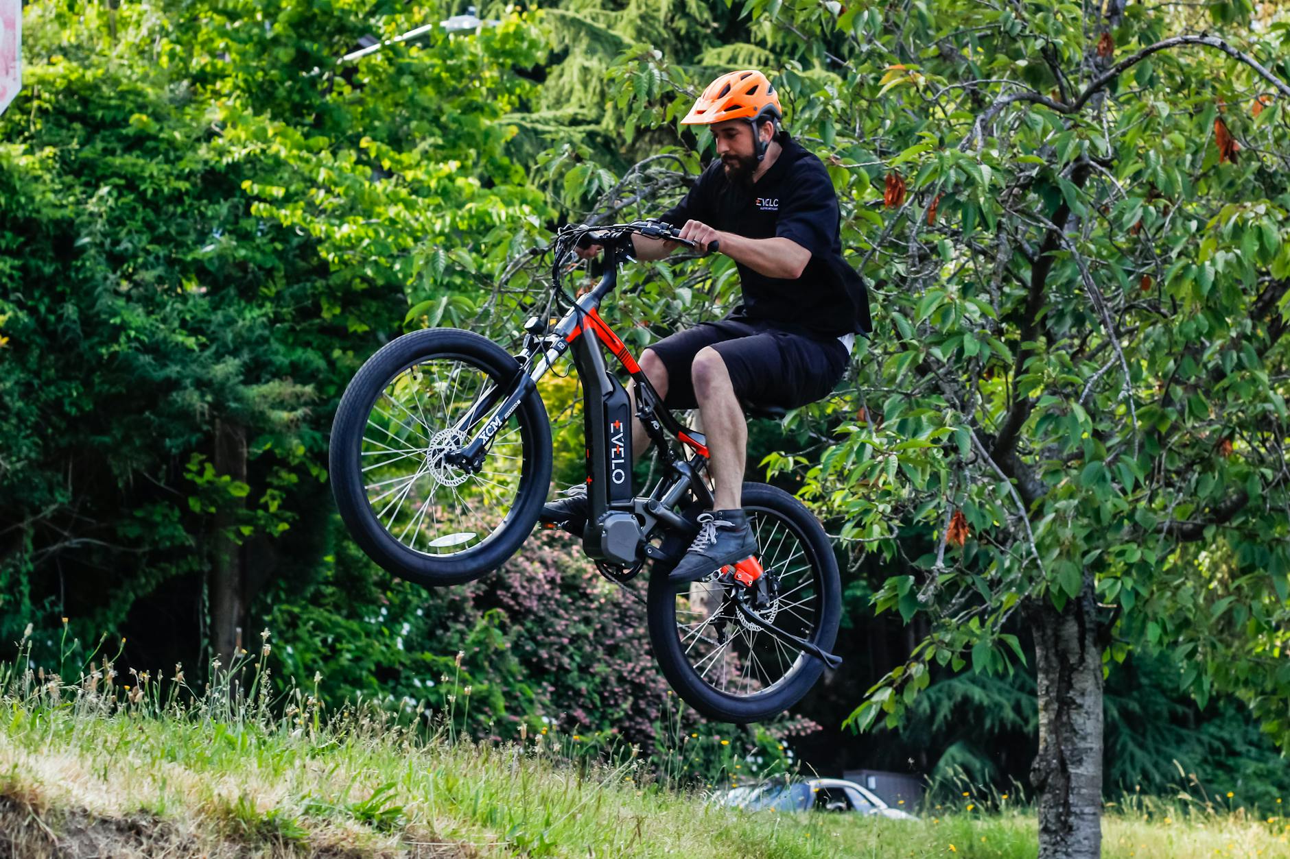 Energetic ride with an electric bike in a lush Seattle park.